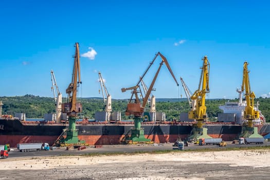 a large ship loading grain for export. Water transport 