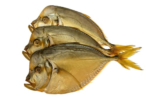 Three smoked vomer fish, on a white plate isolated