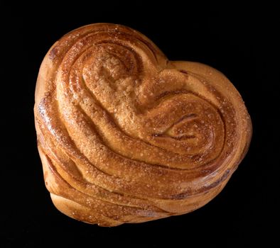 Sweet ruddy bun on black background