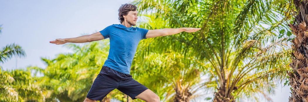 Man doing yoga in a tropical park. BANNER, LONG FORMAT