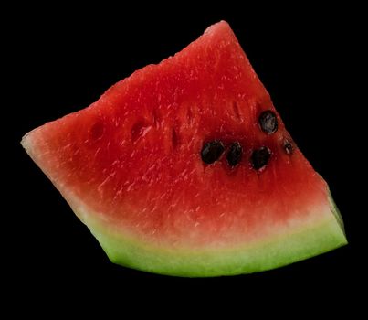 Piece of ripe watermelon, on black background, isolated