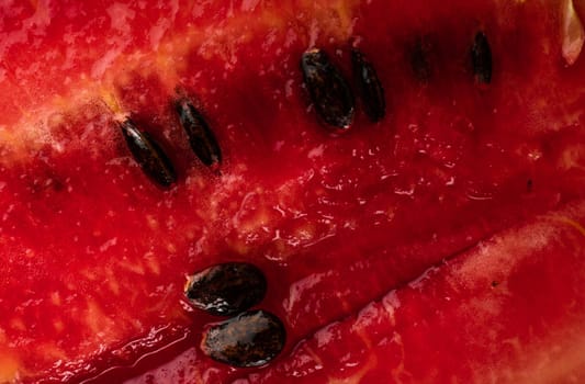 Ripe watermelon pulp and watermelon seeds close up