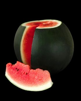 Ripe watermelon with cut piece of watermelon, on black background