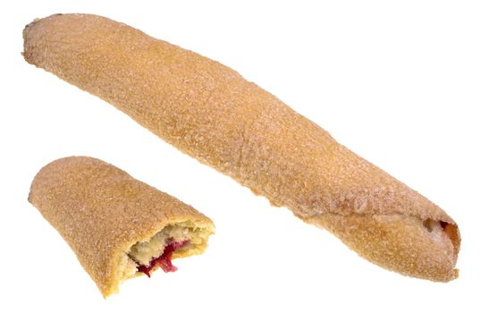 Roll of thin dough with cherry filling and sprinkled with sugar on top on white plate