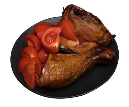 Chicken meat and tomatoes on a black plate on a white background in isolation