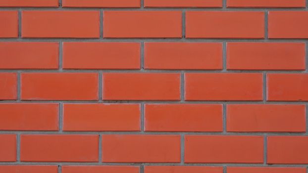 Solid wall of red whole brick, texture