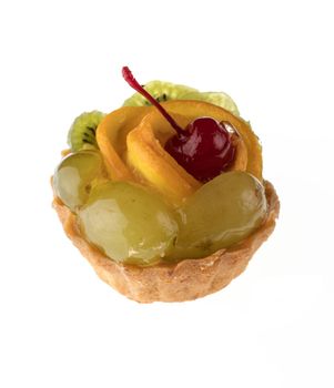 Dessert, fruit cake, with cherry grapes and orange slices, on a white background in isolation