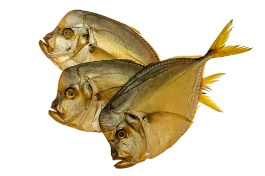 Three smoked vomer fish, on a white plate isolated