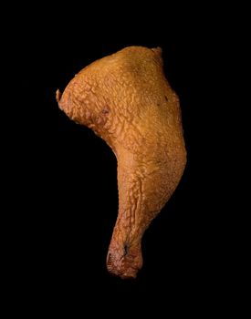 Appetizing smoked chicken legs, Ice, on a black background in isolation poultry meat, chicken smoked meat