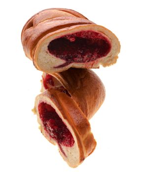 Confectionery, bun in the form of a roll cut into three parts, on a white background