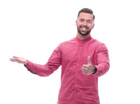 in full growth. smiling young man with a gesture welcome. isolated on white background