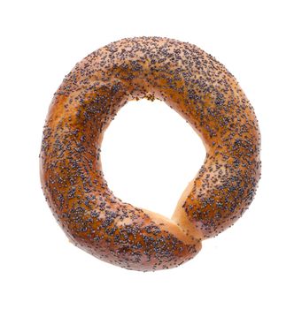 Ruddy bagel with top sprinkled with poppy seeds, on a white background