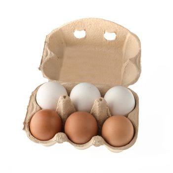 Chicken eggs in a paper disposable tray, in the amount of six pieces, on a white background in isolation