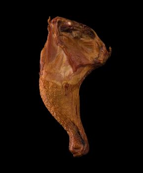 Appetizing smoked chicken legs, Ice, on a black background in isolation poultry meat, chicken smoked meat