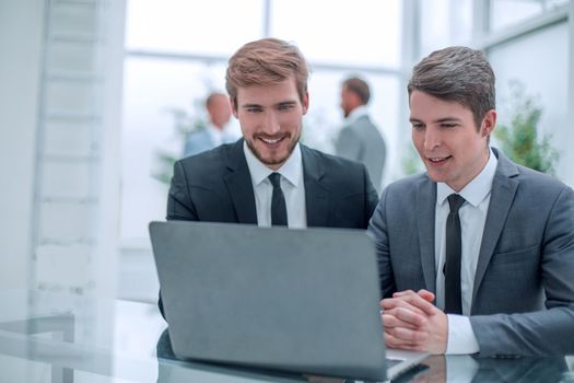 close up. two business men sitting at an office Desk. people and technology