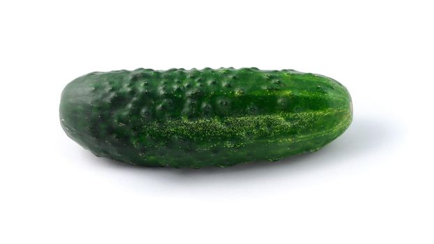 close-up shot of fresh green cucumber on a white background in isolation