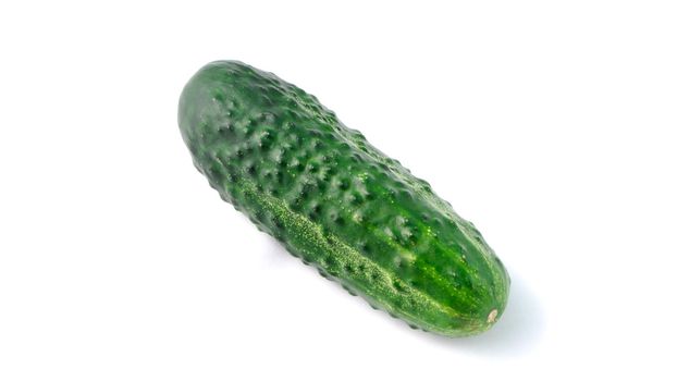 close-up shot of fresh green cucumber on a white background in isolation