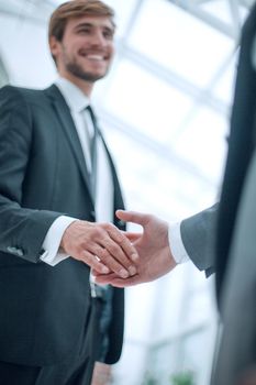 close up. image of business people holding out their hands for a handshake