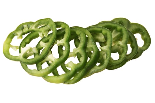 Green bell pepper sliced in pieces, slices on a white background in isolation