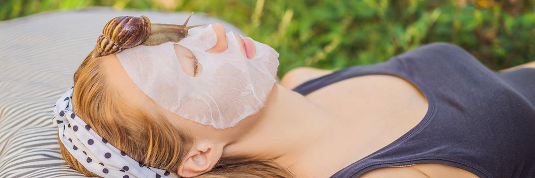 Young woman makes a face mask with snail mucus. Snail crawling on a face mask. BANNER, LONG FORMAT