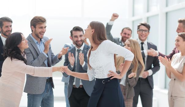 happy employees congratulating their leader. success concept