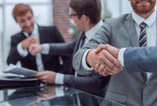 close up. business people shaking hands during a business meeting . business concept