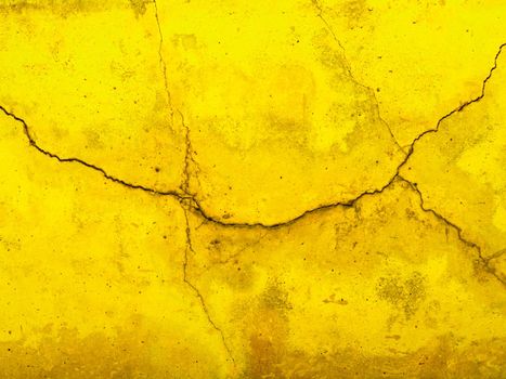 Crack yellow facade concrete wall texture with old vintage style, Blank of shiny yellow paint cement background with copy space concept