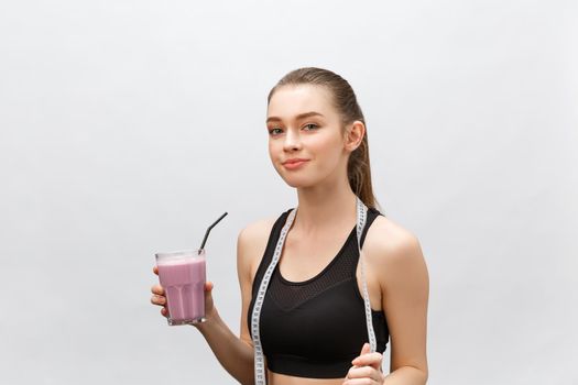 young happy woman with healthy diet shake drinking for sport and fitness