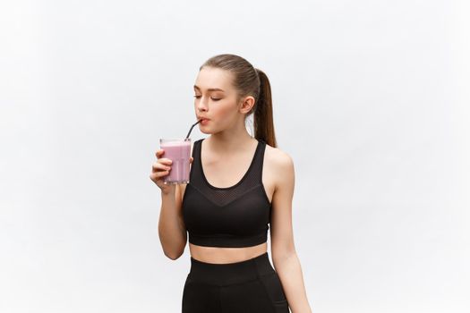 young happy woman with healthy diet shake drinking for sport and fitness
