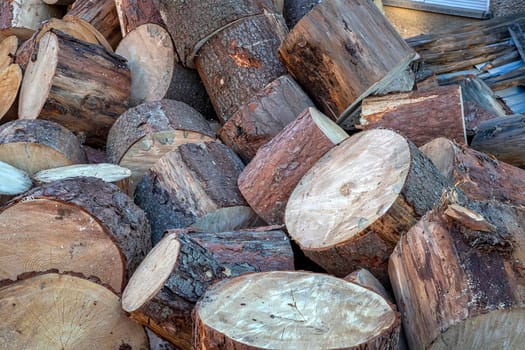 Pile of wood logs ready for winter. Wood logs texture background