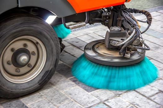 Sweeper truck, vehicle cleaning machine, clean urban road the streets in the city. Close up