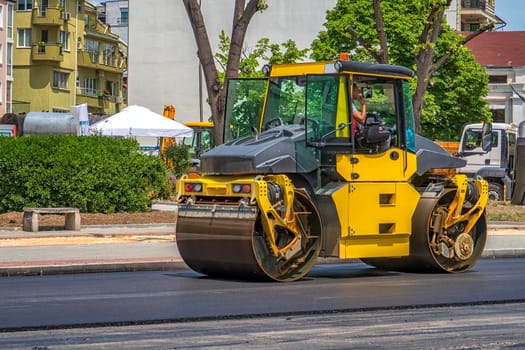 Drum roller making new road at the city. Horizontal view