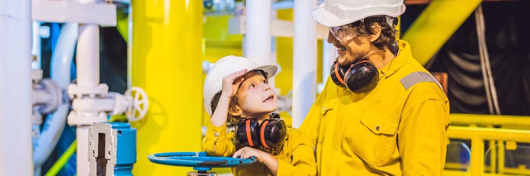 BANNER, LONG FORMAT Young man and a little boy are both in a yellow work uniform, glasses, and helmet in an industrial environment, oil Platform or liquefied gas plant.