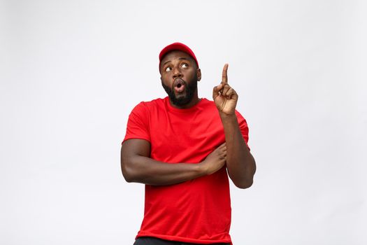 African american man over isolated background surprised with an idea or question pointing finger with surprise face
