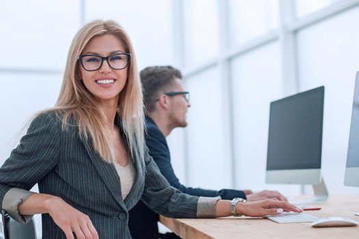 close up. a young woman works in a computer room. people and technology