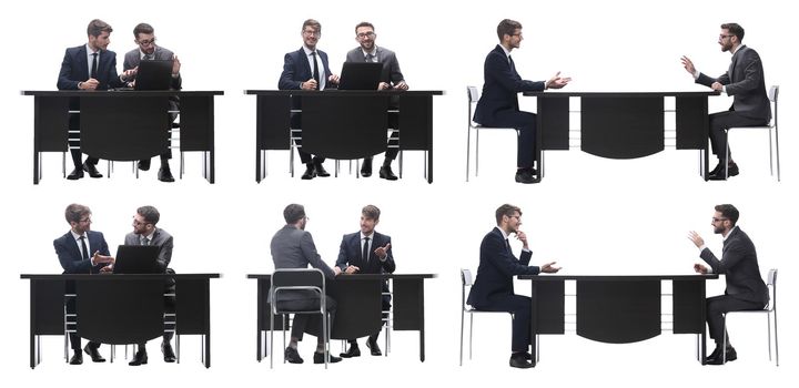 top view. two business people sitting at the Desk. isolated on white background