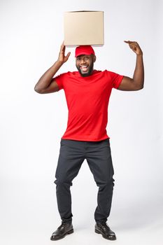 Happy African American man with a box on his head.