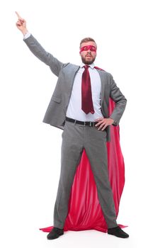 in full growth. confident superhero businessman pointing to copy space.