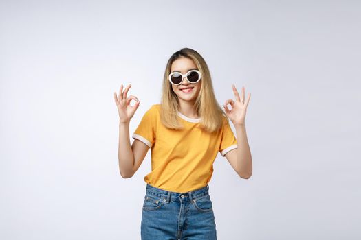Asian young woman beautiful smile with ok finger sign isolate on white background.