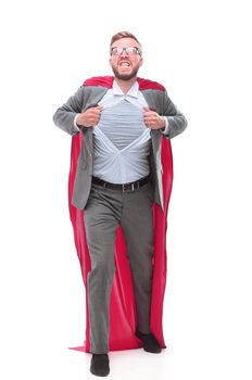 in full growth. businessman in superhero Cape rips his shirt. isolated on white