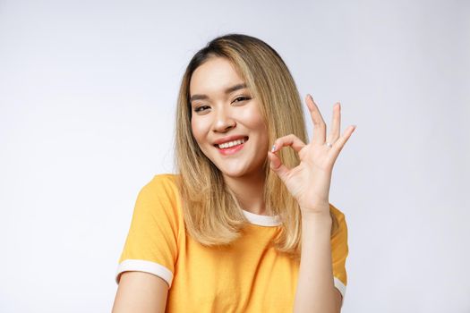 Asian young Businesswoman with ok sign gesture
