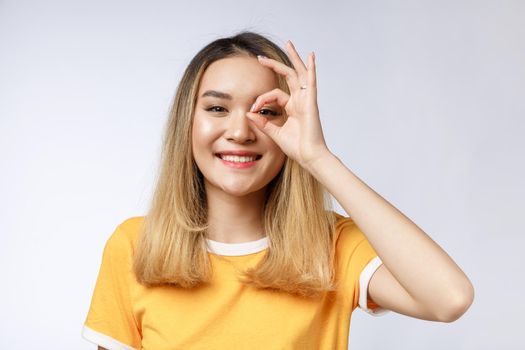 Asian young Businesswoman with ok sign gesture