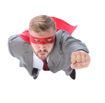 flying superhero businessman looking at the camera. isolated on white background