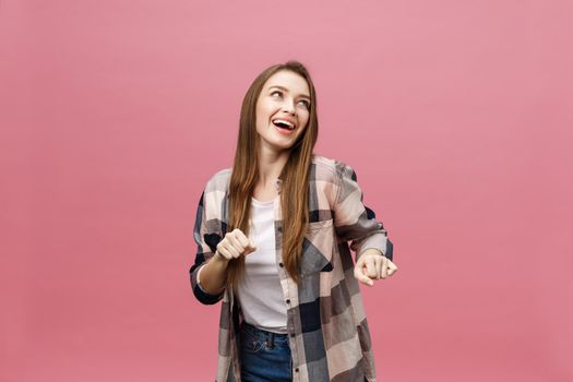 Portrait young girl dancing with inspired face expression. Active young woman in casual summer outfit having fun indoor