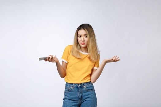 Unhappy Asian girl on the phone , Angry Asian woman talking phone with her boyfriend, isolated on white background