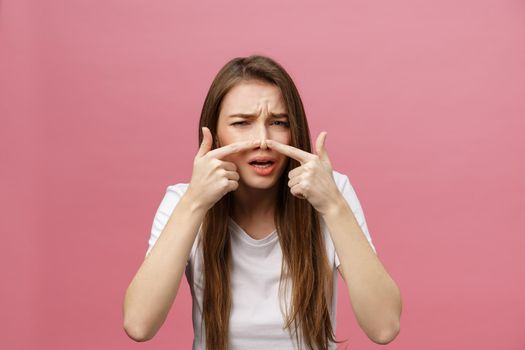 Face Skin Problem - young woman unhappy touch her skin isolated, concept for skin care