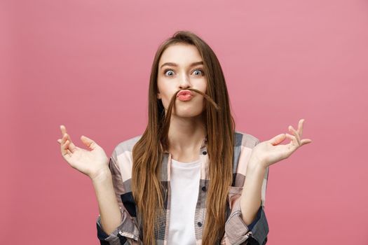 Portrait of crazy adorable young woman playing with her hairs. emotional girl isolated on white background.