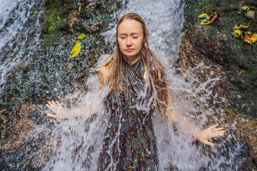 Young woman tourist in Holy springs Sebatu in Bali.