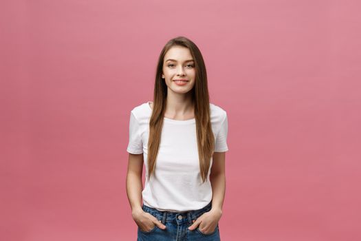 Surprised happy beautiful woman looking in excitement. Isolate over pink background and copy space