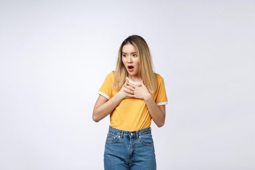 Young Asian woman with surprised excited happy screaming. Cheerful girl with funny joyful face expression.